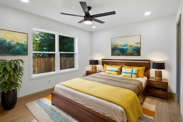 bedroom featuring light wood-type flooring and ceiling fan