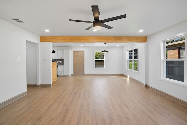 unfurnished living room featuring ceiling fan, beam ceiling, and light hardwood / wood-style flooring