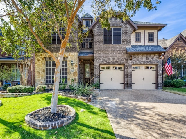 view of front of home featuring a garage and a front lawn