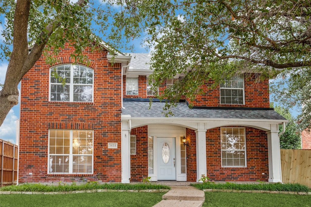 front facade with a front lawn