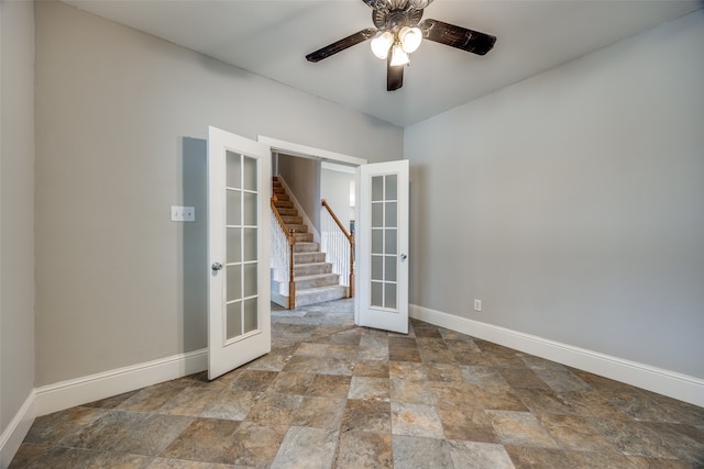 empty room with french doors and ceiling fan