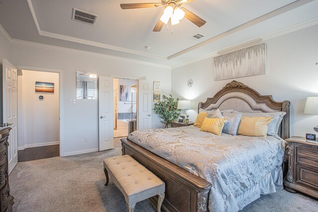 bedroom with carpet, ceiling fan, ornamental molding, and ensuite bath