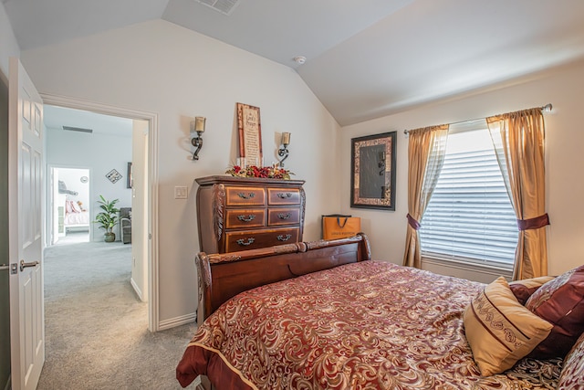 bedroom with light carpet and vaulted ceiling