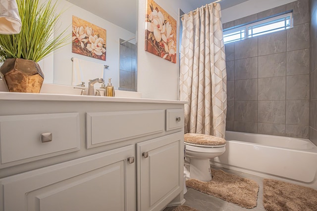 full bathroom with vanity, shower / tub combo, and toilet