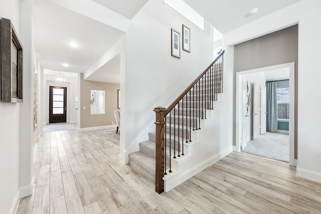 foyer entrance with light hardwood / wood-style floors