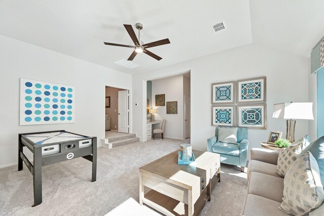 carpeted living room featuring lofted ceiling and ceiling fan