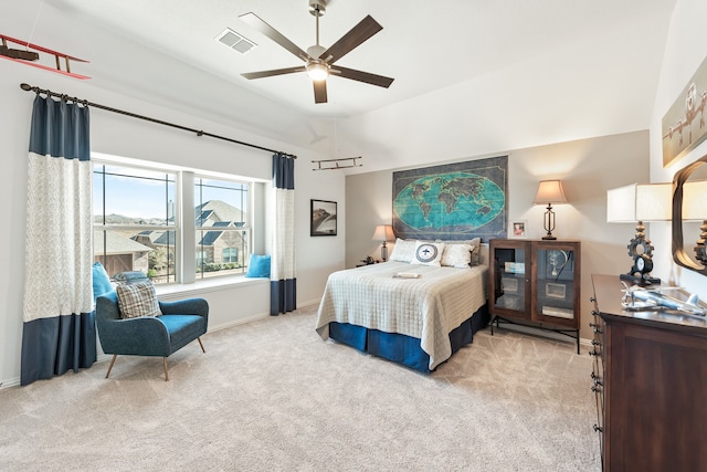 bedroom featuring light carpet and ceiling fan