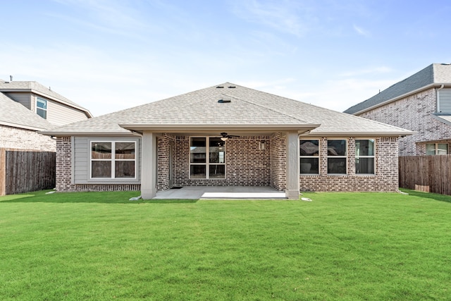 back of house with ceiling fan, a patio, and a yard