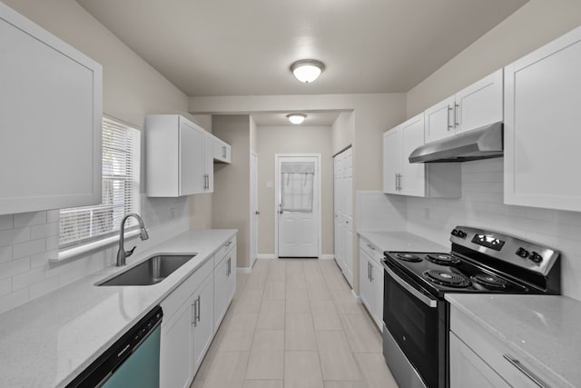 kitchen featuring stainless steel appliances, white cabinets, sink, backsplash, and light stone countertops