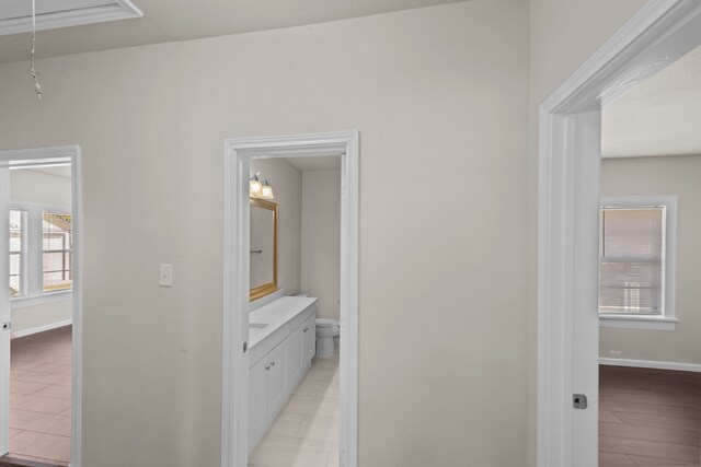 hallway with light hardwood / wood-style flooring