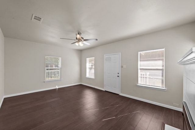 entryway with a baseboard radiator, dark wood-type flooring, and ceiling fan