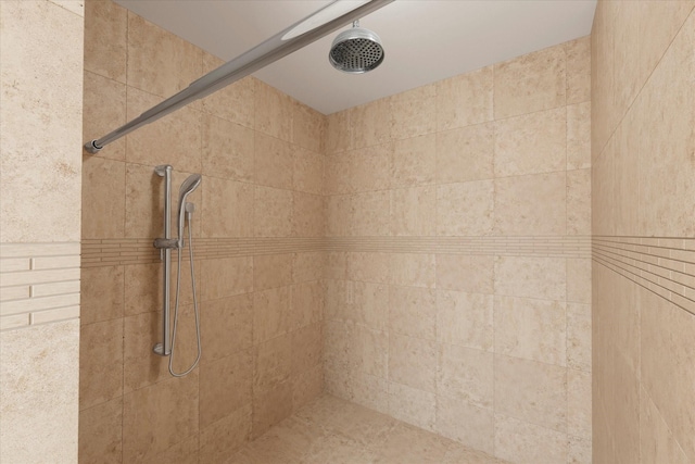 bathroom with tiled shower