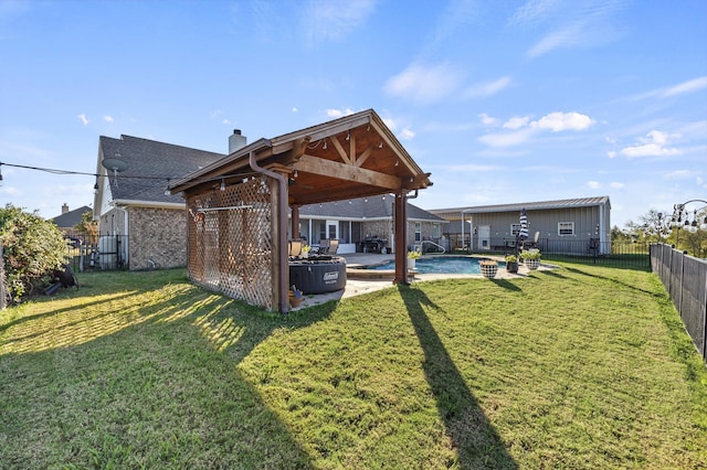 rear view of house featuring a yard, a fenced in pool, and a patio area