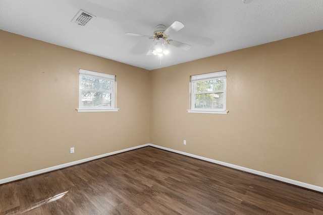 unfurnished room with hardwood / wood-style floors, ceiling fan, and a textured ceiling