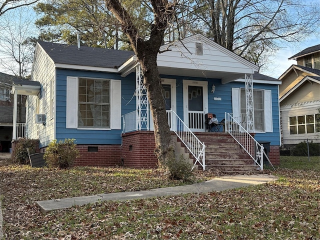 bungalow-style home with cooling unit and covered porch