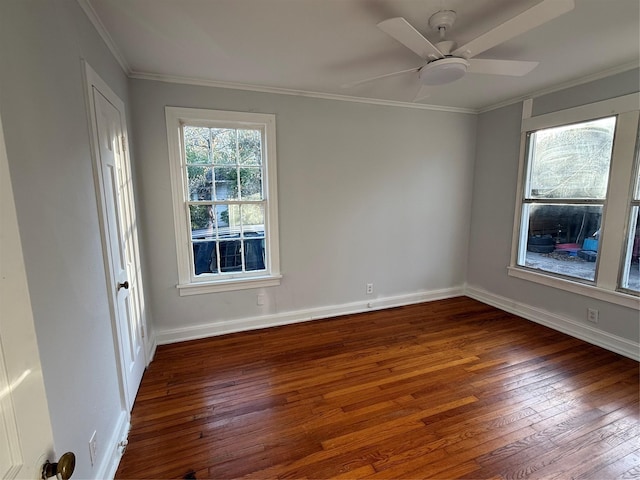 empty room with ceiling fan, ornamental molding, and dark wood-type flooring