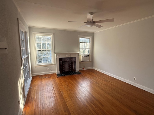 unfurnished living room featuring hardwood / wood-style floors, plenty of natural light, and ornamental molding