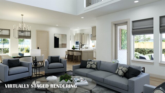 living room featuring hardwood / wood-style floors and an inviting chandelier