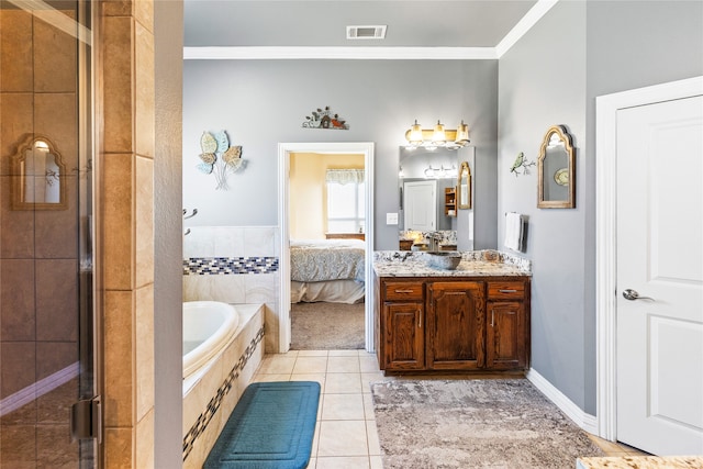 bathroom with tile patterned floors, crown molding, vanity, and independent shower and bath