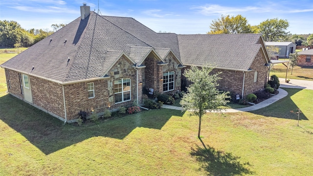 rear view of property with a yard