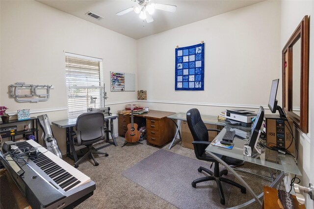 office area with ceiling fan and light carpet