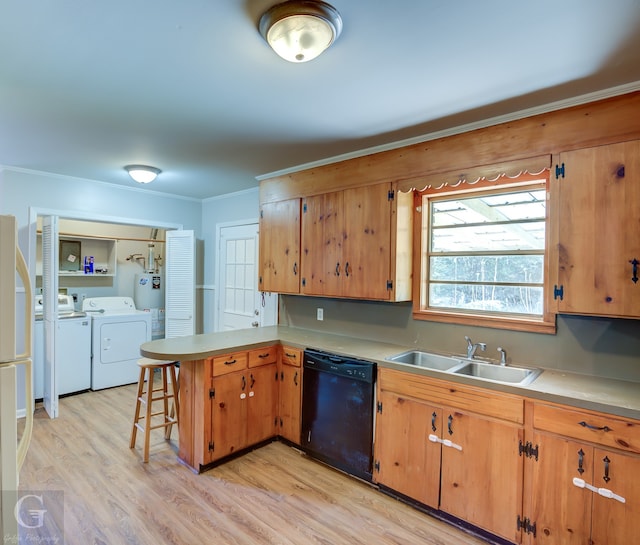 kitchen featuring kitchen peninsula, sink, separate washer and dryer, light hardwood / wood-style flooring, and black dishwasher