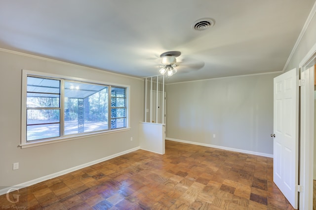 spare room with ceiling fan, parquet flooring, and ornamental molding