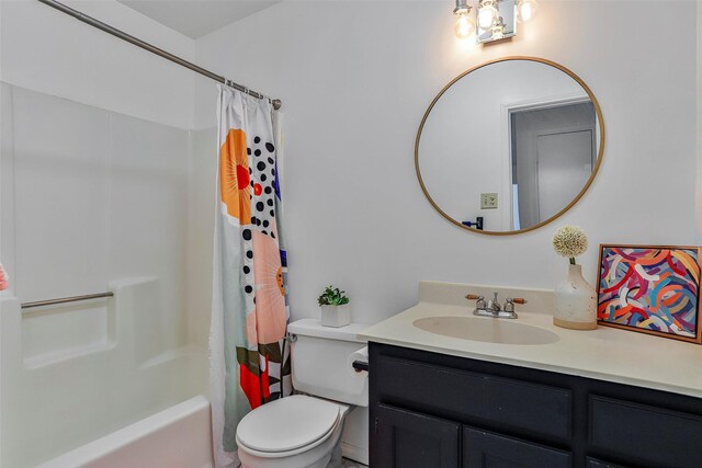 full bathroom featuring vanity, shower / bath combination with curtain, and toilet