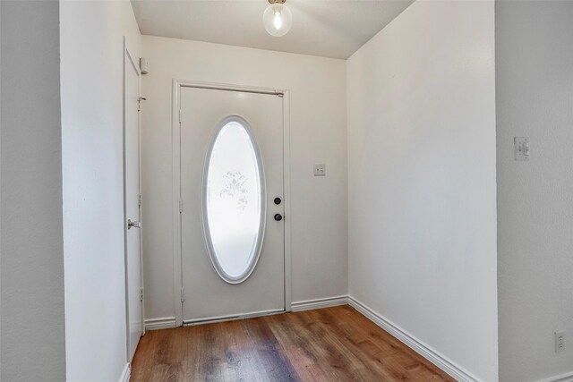 foyer with dark hardwood / wood-style flooring