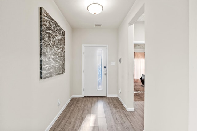 foyer entrance with light wood-type flooring