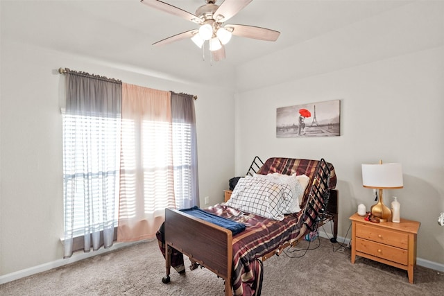 bedroom with carpet, multiple windows, and ceiling fan