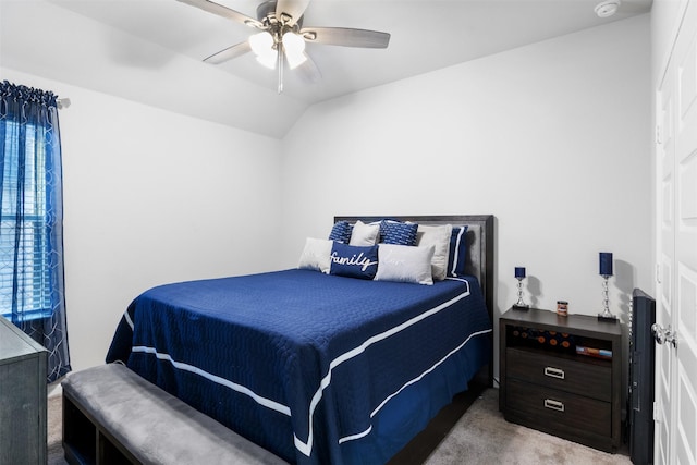 carpeted bedroom with ceiling fan and lofted ceiling