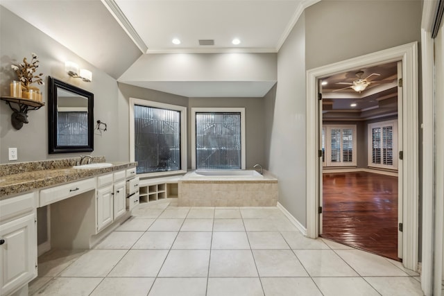 bathroom featuring hardwood / wood-style floors, ceiling fan, vanity, and ornamental molding