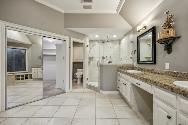 bathroom featuring vanity, tile patterned flooring, and ornamental molding