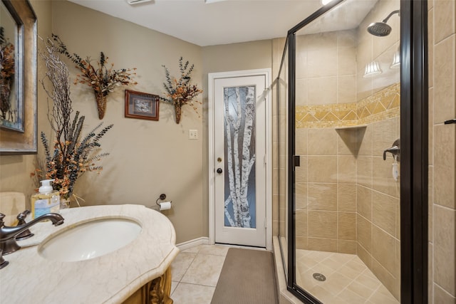 bathroom featuring vanity, tile patterned floors, and a shower with shower door