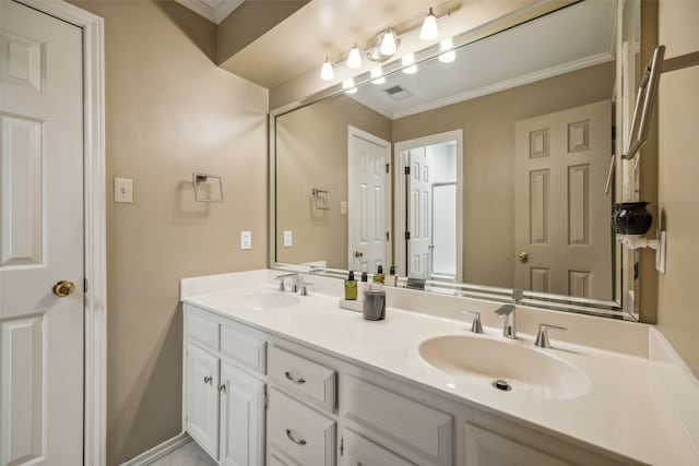 bathroom with vanity and ornamental molding