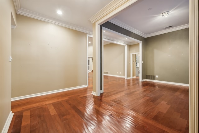 unfurnished room featuring hardwood / wood-style flooring and crown molding