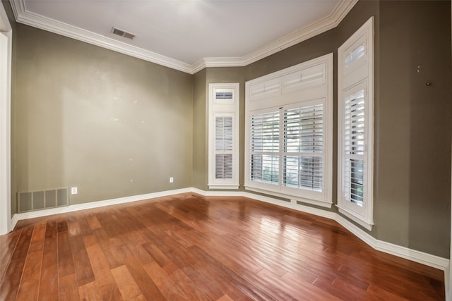 unfurnished room with hardwood / wood-style floors and ornamental molding