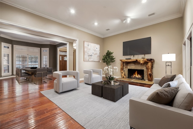 living room featuring hardwood / wood-style floors and ornamental molding