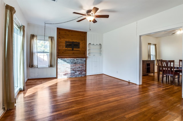 living room featuring ceiling fan and hardwood / wood-style floors