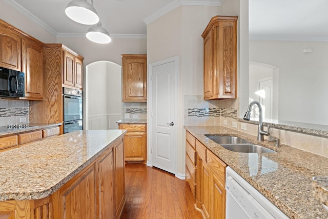 kitchen with light hardwood / wood-style floors, sink, decorative backsplash, and double oven