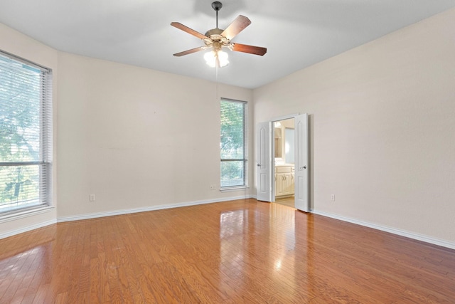 spare room with light hardwood / wood-style floors and ceiling fan