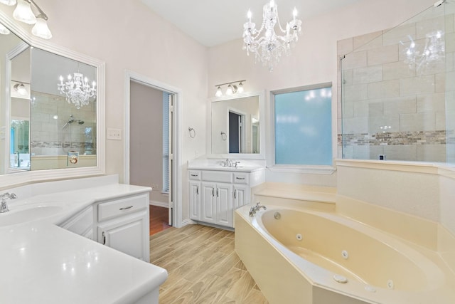 bathroom featuring independent shower and bath, vanity, and wood-type flooring