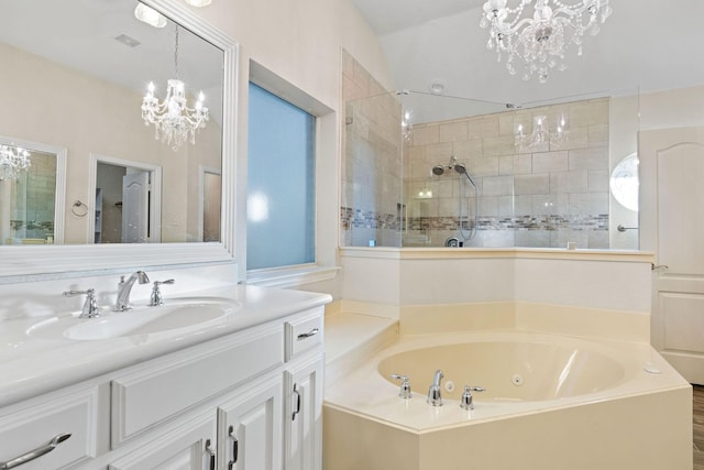 bathroom featuring vanity, plus walk in shower, and an inviting chandelier