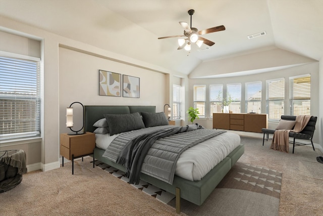 bedroom with ceiling fan, light carpet, and vaulted ceiling