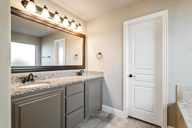 bathroom with vanity and tile patterned floors