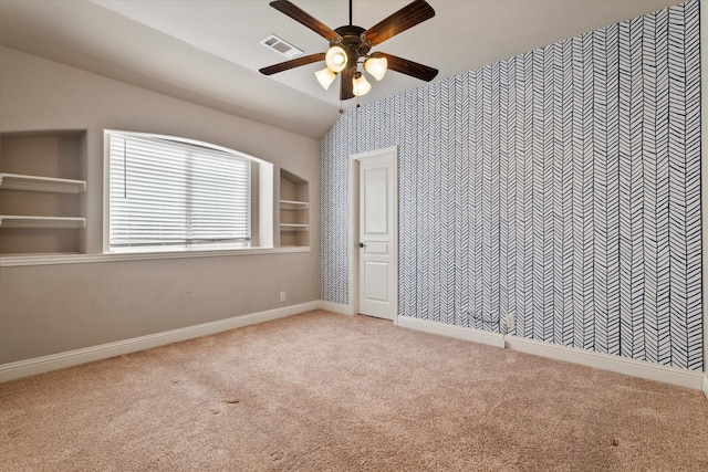 unfurnished bedroom featuring vaulted ceiling, ceiling fan, and light colored carpet