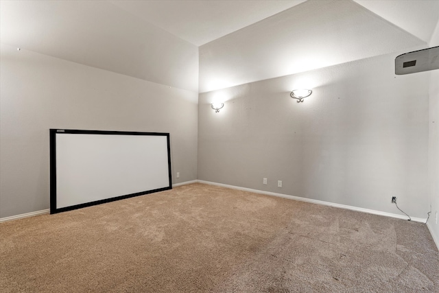 cinema featuring carpet flooring and lofted ceiling