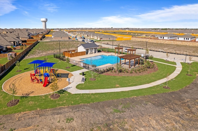 view of pool featuring a playground