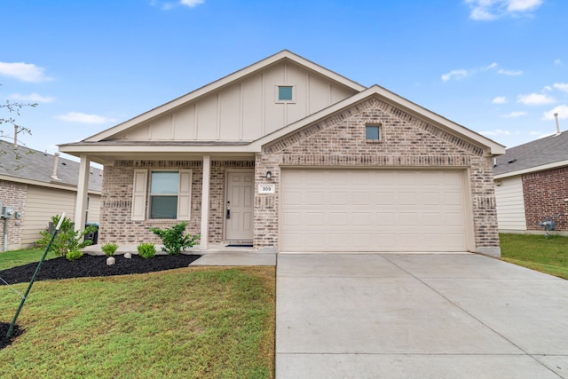 view of front of house with a garage and a front lawn